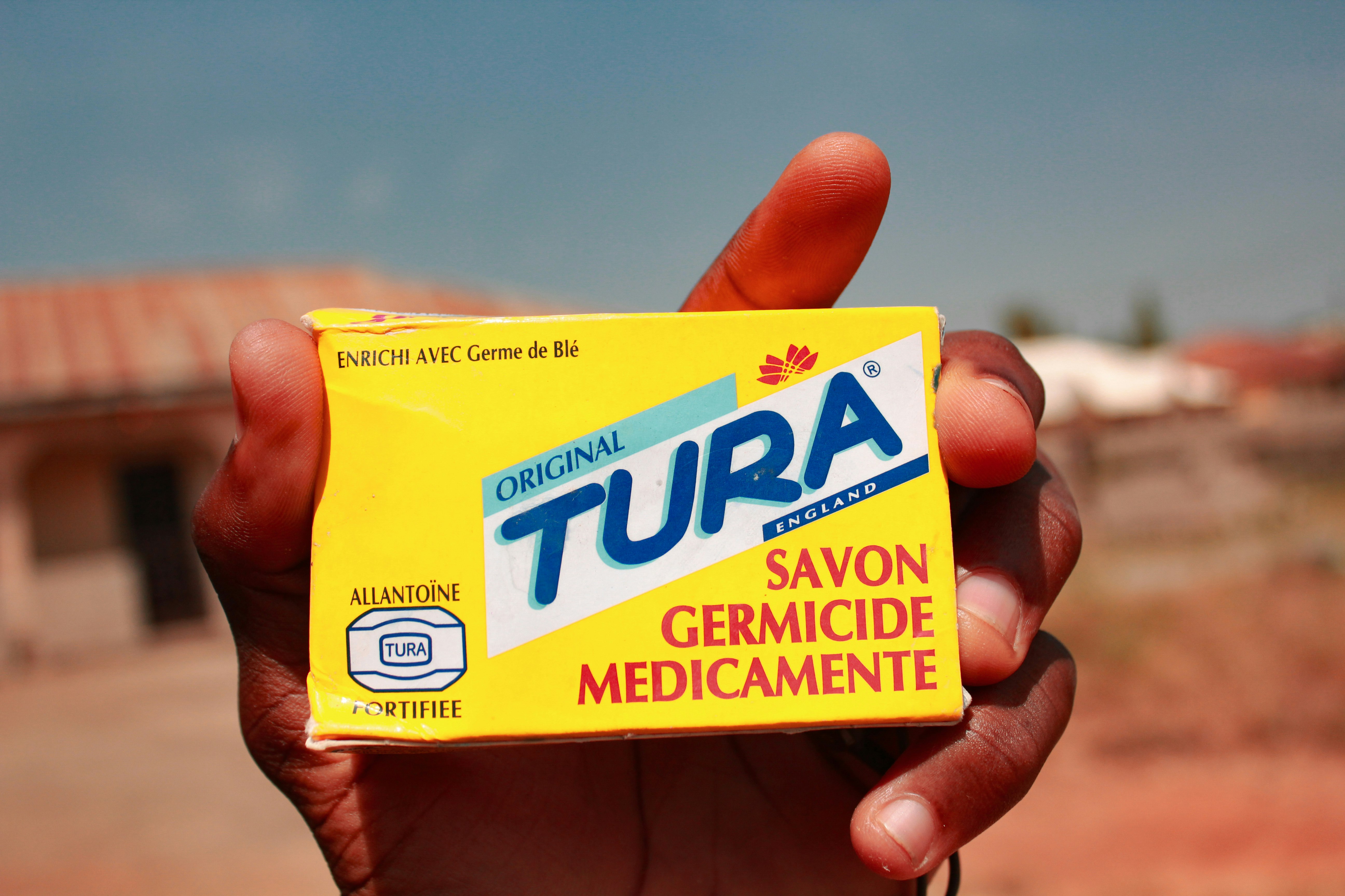 yellow and blue Tura savon germicide mdicamente box